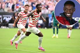 United States forward Folarin Balogun (20) reacts with midfielder Sebastian Berhalter (14) after scoring a goal in the second half against Senegal on May 31, 2026. Bob Donnan-Imagn Images